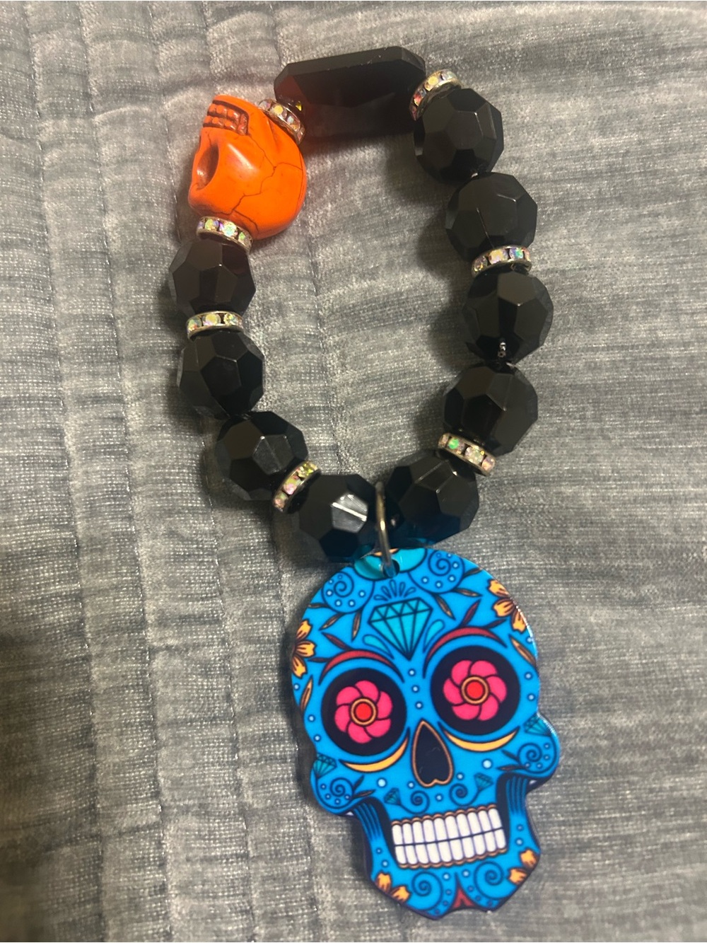 Black Beaded Bracelet with Blue Sugar Skull Charm and Orange Accent